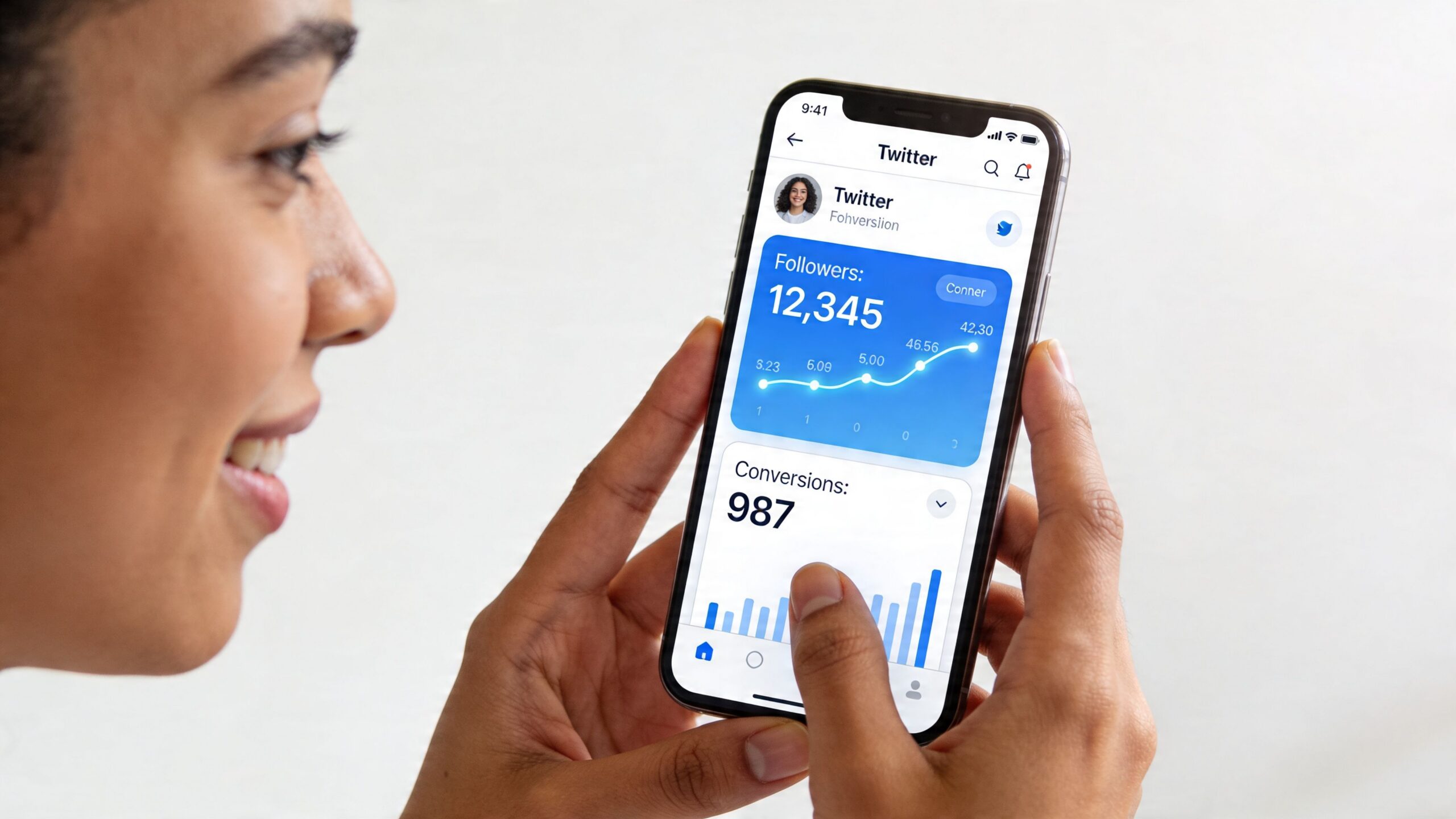 A person viewing analytics showing follower growth and conversion data on a smartphone screen.